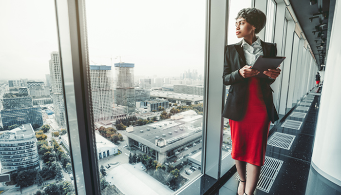Businesswoman Looking Out Over City
