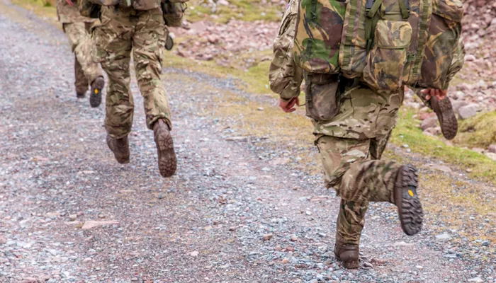 Soldiers Walking In Military Kit