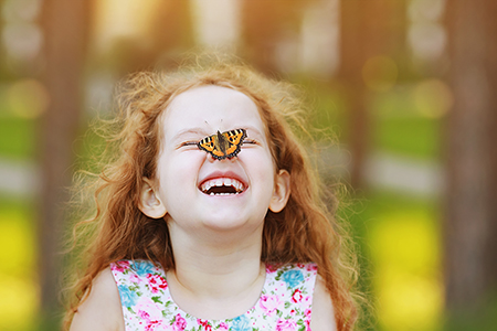 Young girl with butterfly