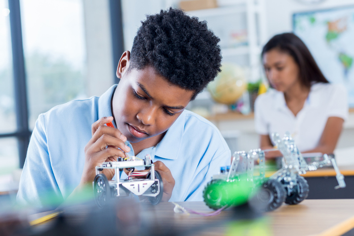 School Pupil Working In Class