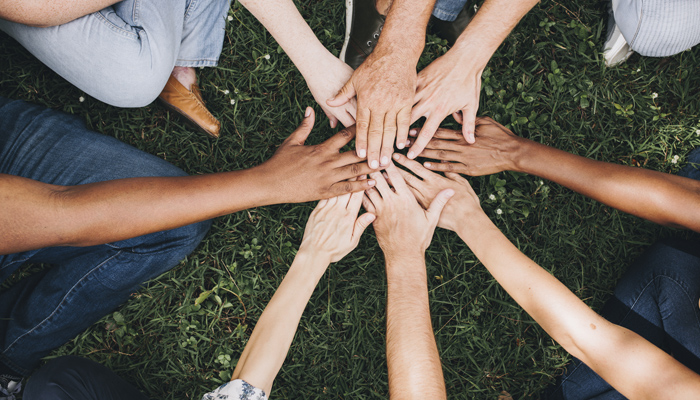 Employee Benefits Working Together Hands In A Circle
