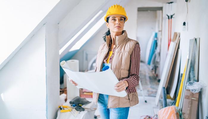 Female Contractor Studying Plan