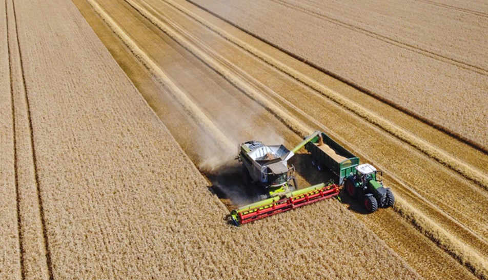 Combine harvester in a field on a sunny day