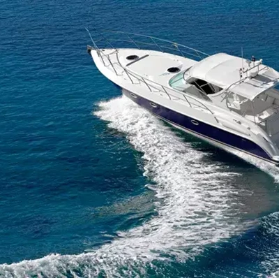 Motorboat curving through water creating wave crests Motorboat curving through water creating wave crests