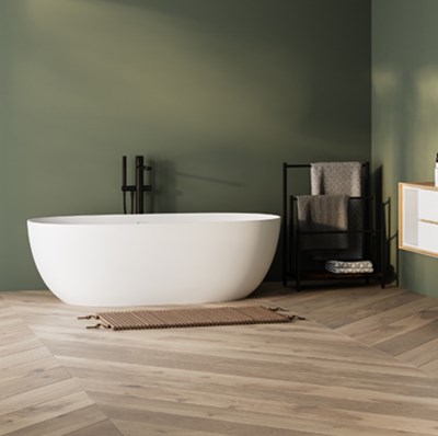 Free standing modern white cast stone back on wide parquet flooring with large floor to ceiling window showing greenery Free standing modern white cast stone back on wide parquet flooring with large floor to ceiling window showing greenery