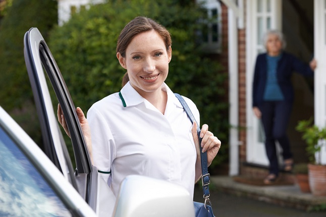 Home carer arriving at home in car