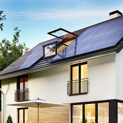 Modern three story home with roof covered in solar panels