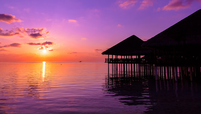 Colourful Sunset Over A Water Villa