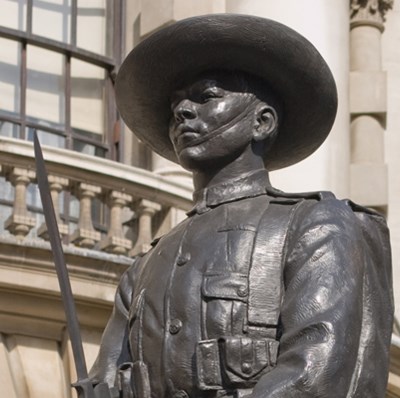 Statue of a Gurkha outside large stone buildings Statue of a Gurkha outside large stone buildings