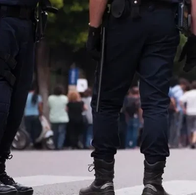 officers guarding crowd at demonstration officers guarding crowd at demonstration