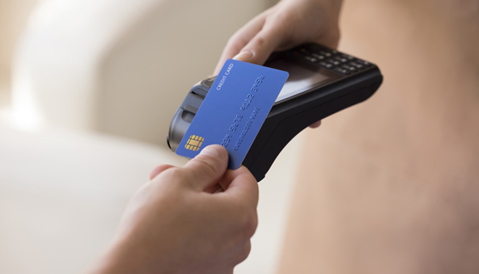 Blue debit card on payment machine